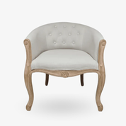 Sillón capitoné tapizado en madera natural