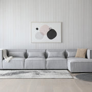 Sofá esquinero modular 4 plazas con puff gris Leila
