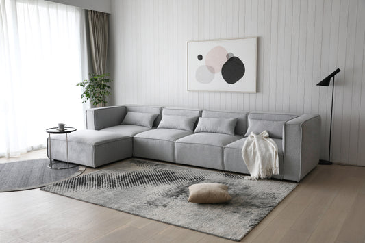 Sofá esquinero modular 4 plazas con puff gris Leila