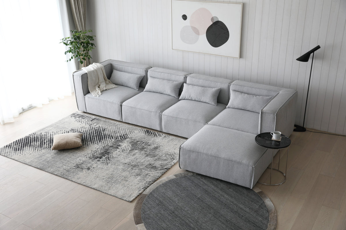 Sofá esquinero modular 4 plazas con puff gris Leila