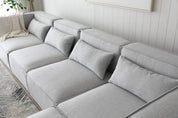 Sofá esquinero modular 4 plazas con puff gris Leila